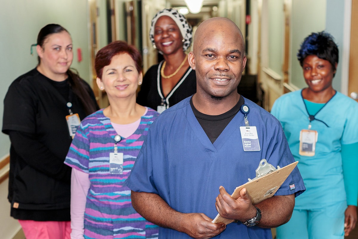 Caregiver team in the hallway at East Bay Post Acute