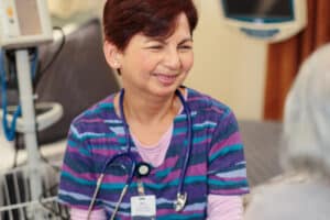 Happy caregiver with a resident at East Bay Post Acute