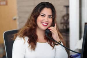 Happy receptionist at East Bay Post Acute