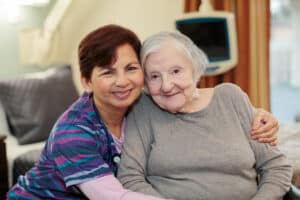 East bay nurse smiling with elderly resident