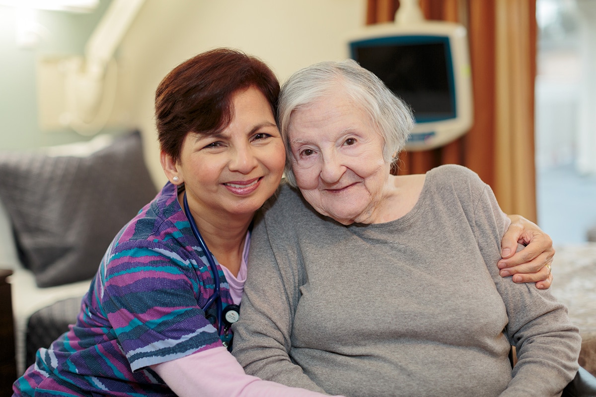 East bay nurse smiling with elderly resident