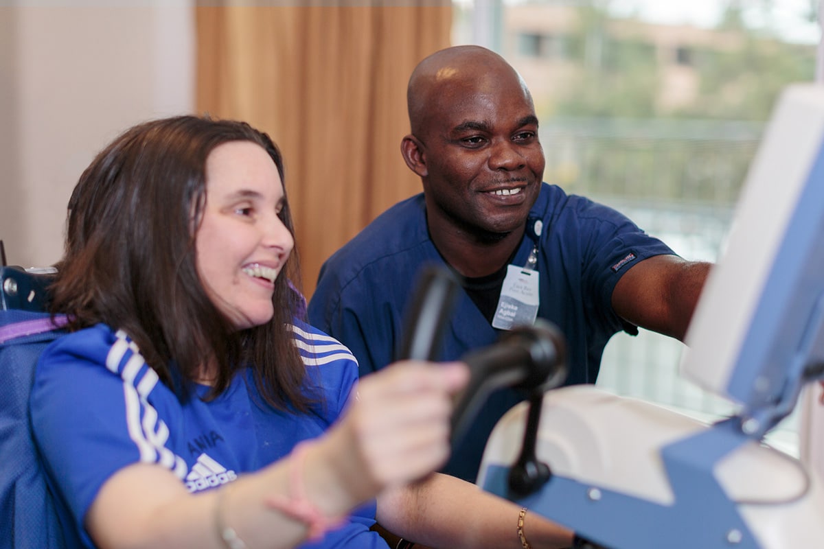 happy Therapist and a resident in the Rehab Gym at East Bay Post Acute