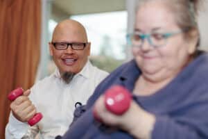 Therapist and a resident in the Rehab Gym at East Bay Post Acute