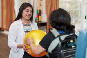 Therapist and a resident in the Rehab Gym at East Bay Post Acute