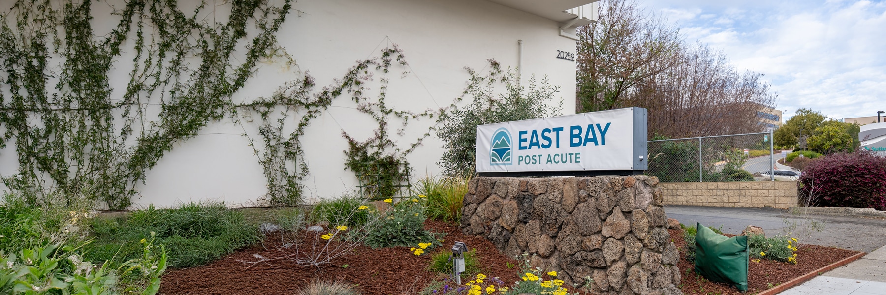 east bay post acute exterior of building with east bay sign