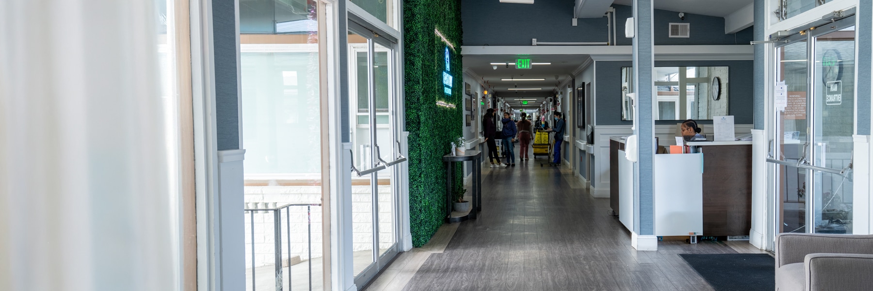 east bay post acute long hall with large windows and tall ceilings